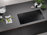 Miele Induction Cooktop with 5 round cooking zones - Black (KM7740FR)